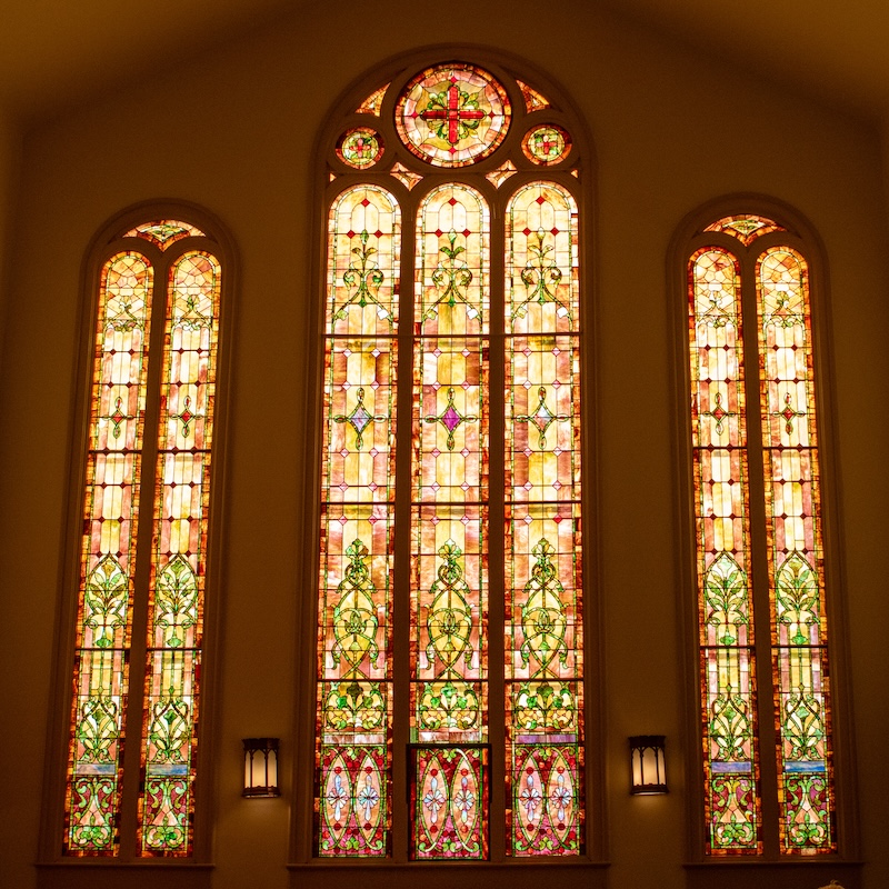 A view of the stained glass windows on the west side of the sanctuary.